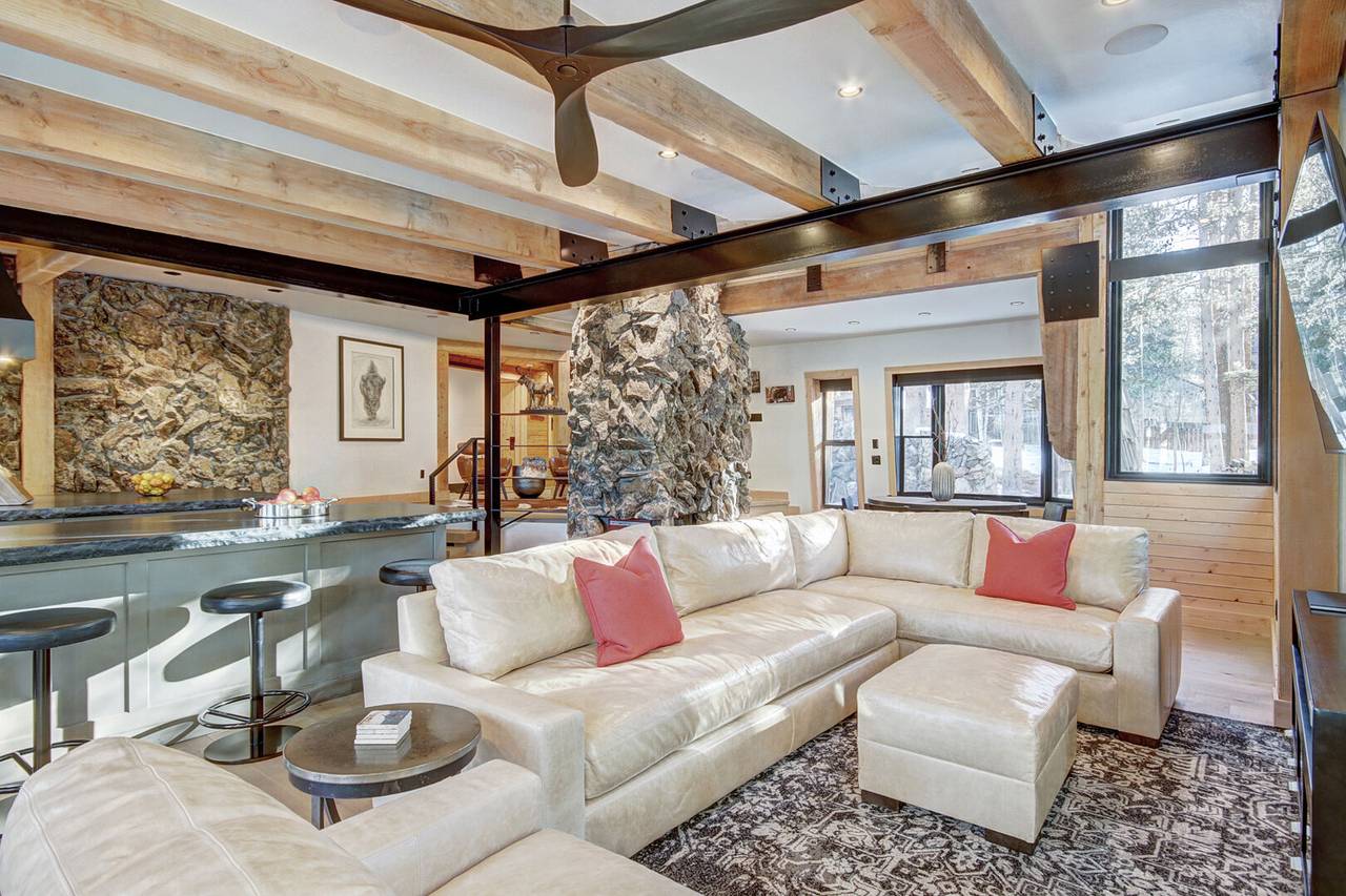 Relax on the living room sectional sofa to take in the wooded view or a watch a movie on the flat screen TV - Arrow Darrow Breckenridge Vacation Rental Relax on the living room sectional sofa to take in the wooded view or a watch a movie on the flat screen TV - Arrow Darrow Breckenridge Vacation Rental