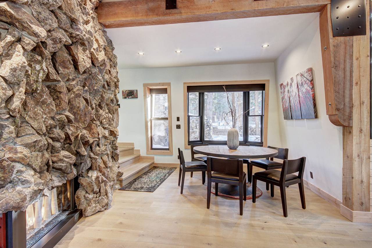 Dining table with seating for 6 situated beside the gas fireplace - Arrow Darrow Breckenridge Vacation Rental Dining table with seating for 6 situated beside the gas fireplace - Arrow Darrow Breckenridge Vacation Rental