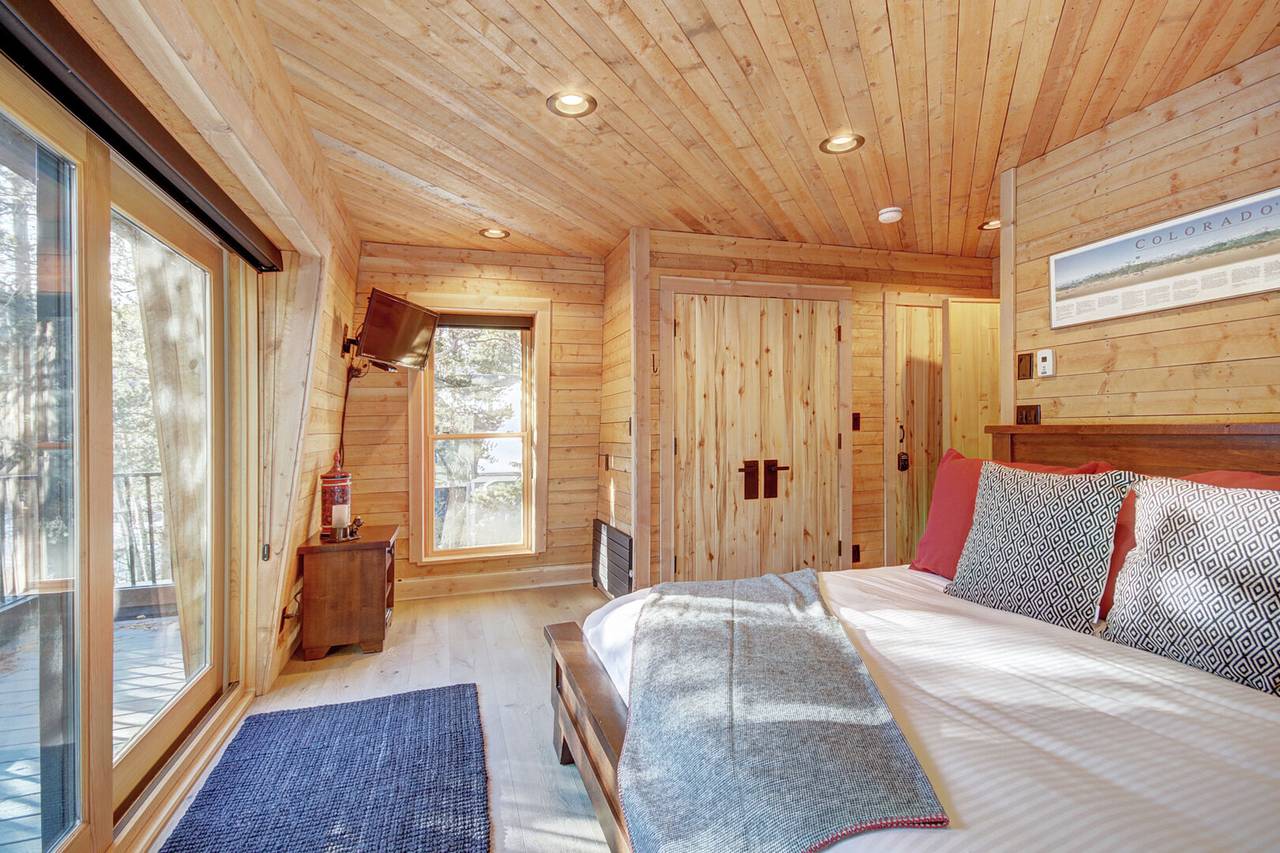 Upper level primary suite with King-size bed, private deck, and private bath - Arrow Darrow Breckenridge Vacation Rental Upper level primary suite with King-size bed, private deck, and private bath - Arrow Darrow Breckenridge Vacation Rental