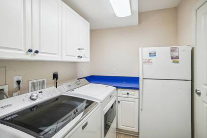 Laundry Area & Extra Refrigerator