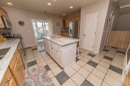 Kitchen with access to screened porch