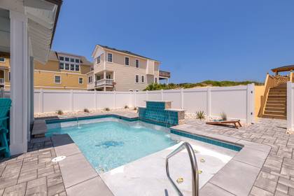Pool Area with Corn Hole
