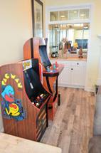 Video arcade games and wet bar in living area. Video arcade games and wet bar in living area.