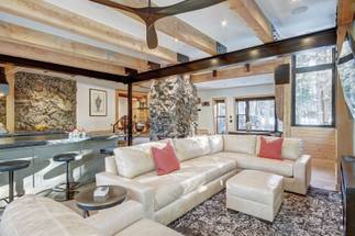 Relax on the living room sectional sofa to take in the wooded view or a watch a movie on the flat screen TV - Arrow Darrow Breckenridge Vacation Rental Relax on the living room sectional sofa to take in the wooded view or a watch a movie on the flat screen TV - Arrow Darrow Breckenridge Vacation Rental